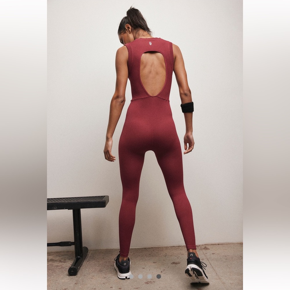 FREE PEOPLE MOVEMENT
Happiness Runs Muscle Open Back Onesie M/L